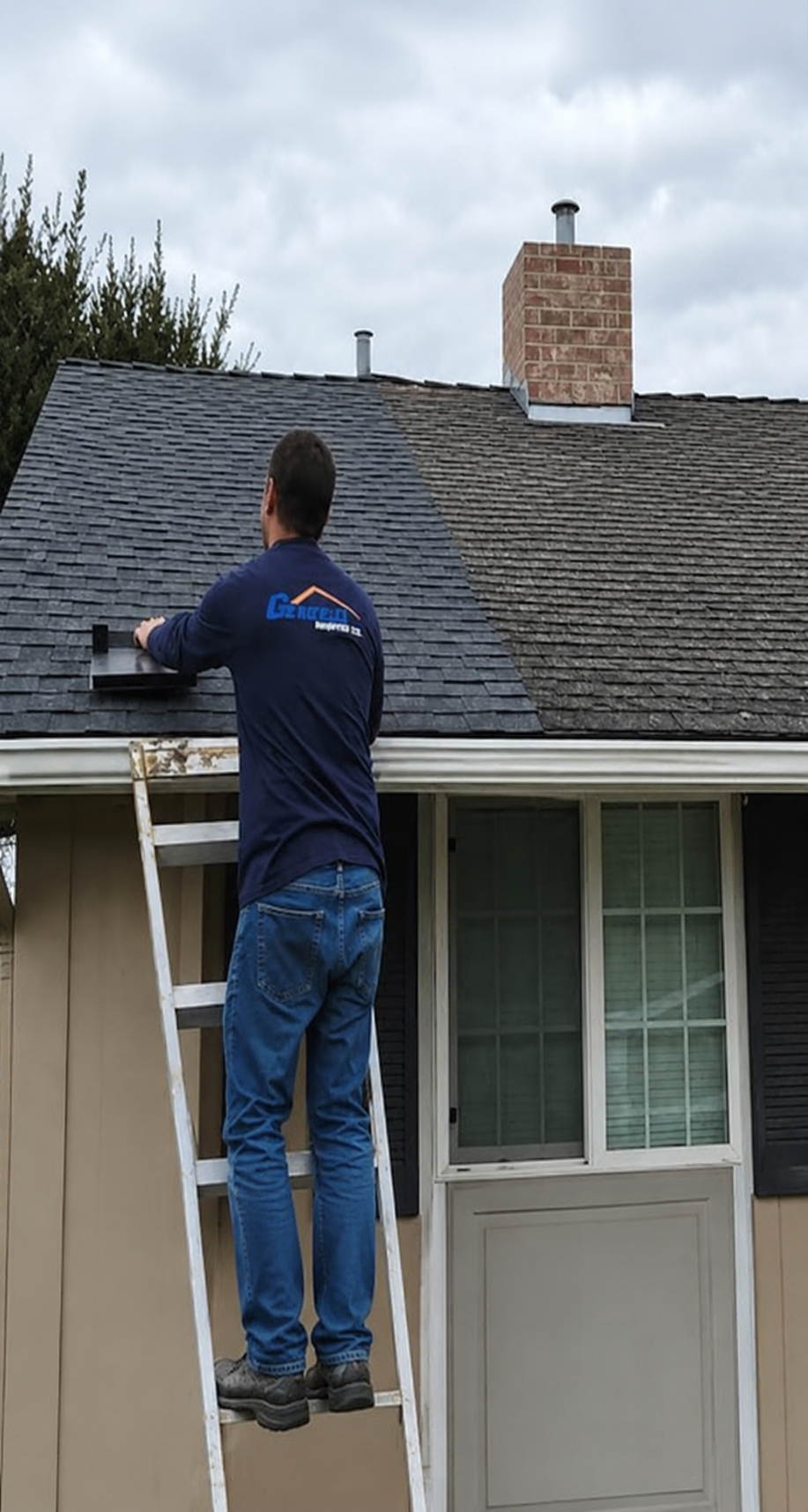 Roofer repairing a small section of damaged shingles