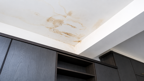 Water dripping from a leaking roof edge